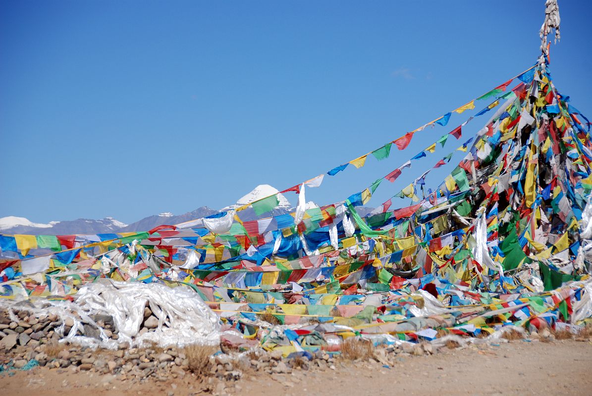 01 First View Of Mount Kailash With Prayer Flags We crested a small hill and a prayer flag festooned pole welcomed us to the first view of Mount Kailash.